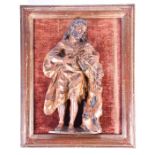 A late 17th century Italian carved giltwood figure depicting a man holding a lamb and a bible,