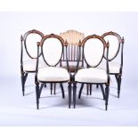 A set of four Victorian style ebonised chairs with gilt embellishment and inlaid burr wood, with