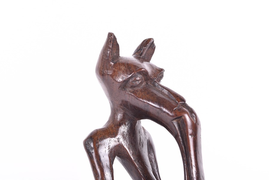 A carved African fertility sculpture modelled as an animalistic figure, 31.5 cm high, together - Image 18 of 20