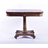 A William IV mahogany card table with brass mounts opening to reveal a green baize interior, with