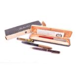 A group of Parker fountain pens and pencils comprising a 1930s Parker vest pocket Duofold 'Pearl &