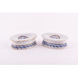 A pair of Chinese Qianlong period blue and white porcelain salts of oval form with painted foliage