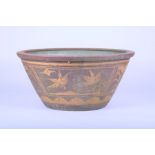 A 19th century Southern Chinese painted ceramic bathtub the outer body with gilt framed cartouches