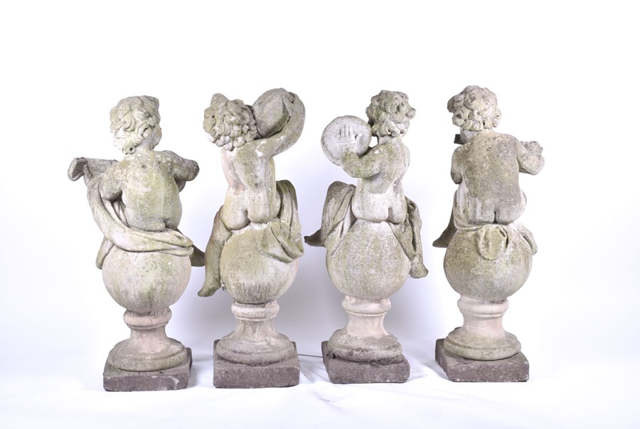 A set of four 20th century Italian musical cherub stoneware sculptures each seated on a sphere, - Image 11 of 17