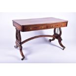 A Regency rosewood and brass mounted lyre end library table in the manner of Gillows, with four