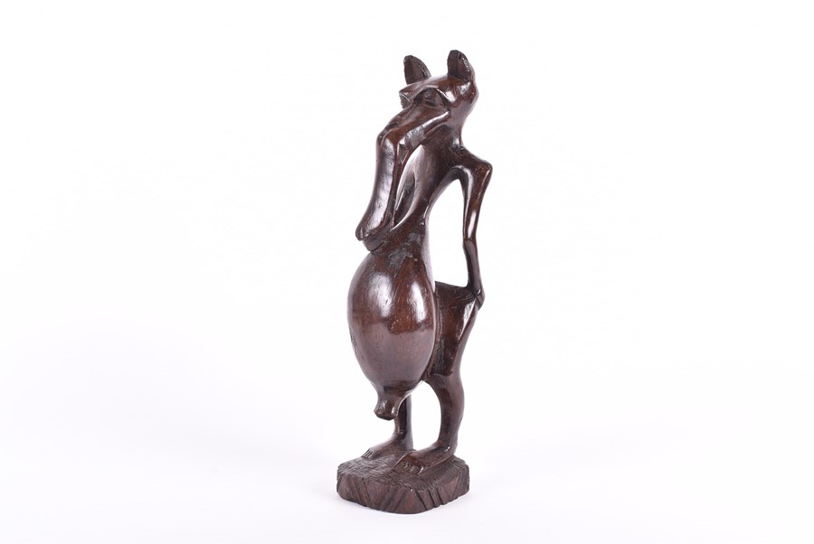 A carved African fertility sculpture modelled as an animalistic figure, 31.5 cm high, together - Image 16 of 20