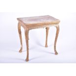 A George II giltwood and gesso occasional table in the style of James Moore or Elizabeth Gumley,
