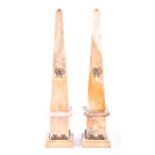 A large pair of Sienna marble ormolu mounted obelisks mounted with ormolu ribbons and flowers, the