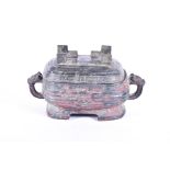 A Chinese archaic footed bronze lidded Xu vessel possibly Western Zhou dynasty, of rectangular