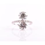 An impressive 20th century platinum and diamond ring in the Toi et Moi style, set with two old