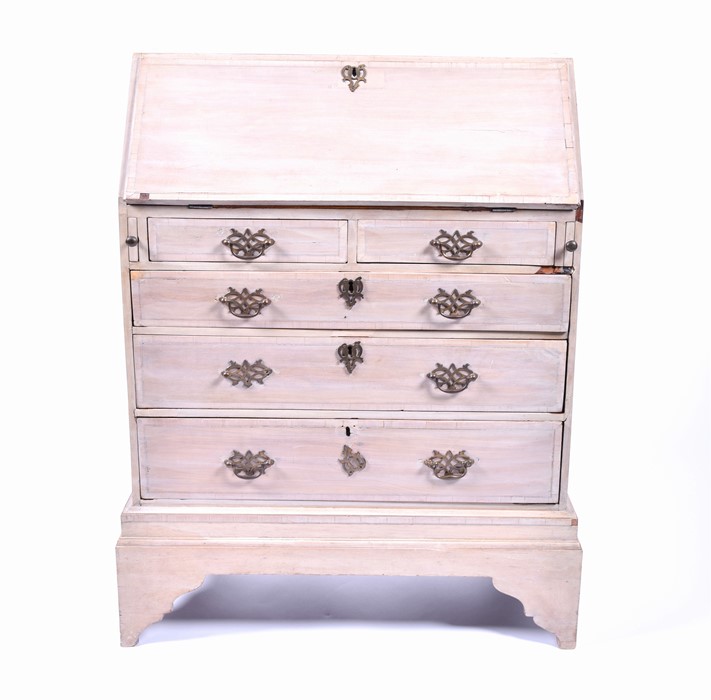 A painted mahogany miniature bureau with drop-down leaf, opening to reveal unpainted interior
