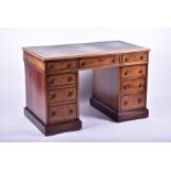 A Victorian mahogany nine-drawer pedestal desk with later tooled green leather scriber, 121 cm