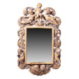 A 19th century style giltwood framed Italian wall mirror modelled with winged and musical cherubs on