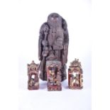 A Qing dynasty carved hardwood sculpture of the laughing buddha modelled as an elder with five