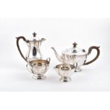 A four piece silver tea set Birmingham 1931, Henry Clifford Davis, comprising of coffee pot, tea