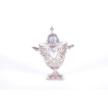 An Edwardian silver hinge-lidded sugar carrier of twin-handled urn form Chester 1905, by George