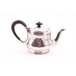 A George V silver bachelor's teapot Sheffield 1921, by Stevenson and Law, with engraved foliate