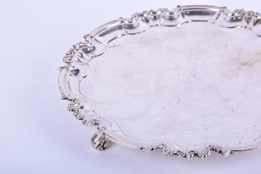 A late Victorian silver salver London 1896, by William Hutton & Sons, with a shaped scroll border, - Image 3 of 5