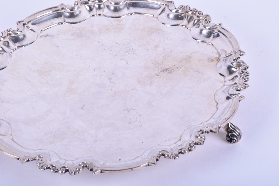 A late Victorian silver salver London 1896, by William Hutton & Sons, with a shaped scroll border, - Image 2 of 5