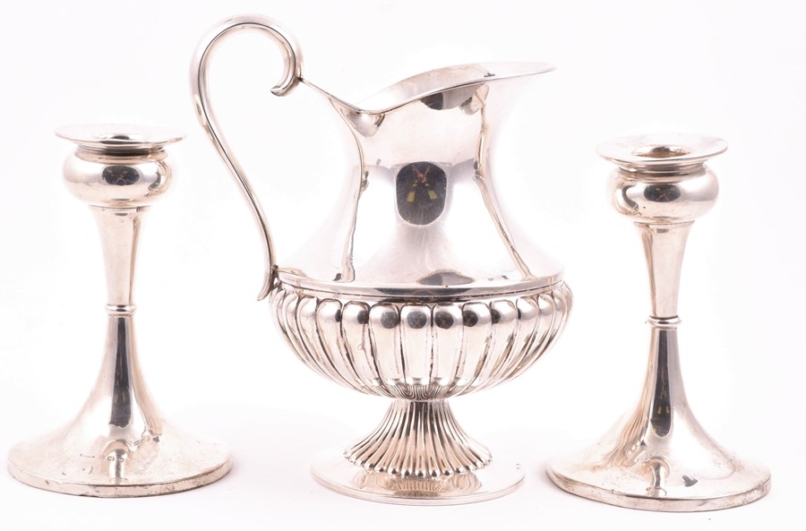 A pair of George V silver candlesticks Birmingham 1936, maker indistinct, 14 cm high, together