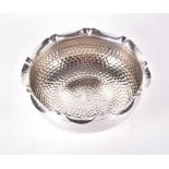 A 20th century Continental hammered silver fruit bowl marked '800', with wavy-edge rim, 25 cm