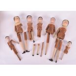 A group seven 19th century Dutch 'peg' toy dolls, each with handpainted detail, several with hands/