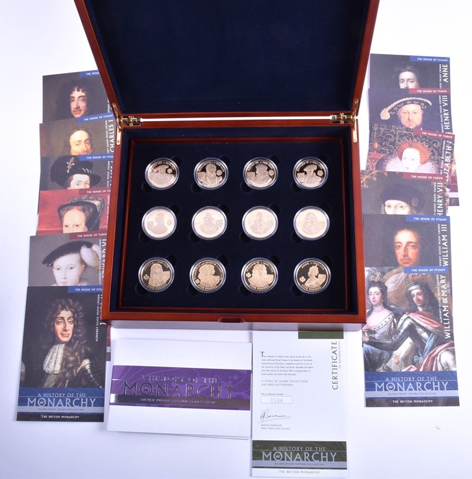 A Royal Mint 'History of the Monarchy' silver proof coin collection in fitted wooden case with