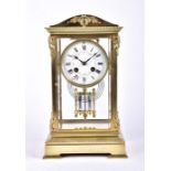 An early 20th century French gilt bronze four-glass mantel clock the eight day drum movement