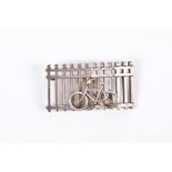 George Jensen, Denmark. An unusual silver brooch in the form of a bicycle leaning against a railing,