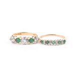 An 18ct yellow gold, diamond, and emerald five stone ring set with three round-cut diamonds of