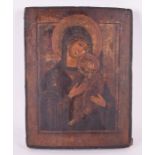 A 19th century Russian Icon of Tikhvinskaya, Mother of God, and child the Virgin Mary gently holding