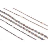 A group of three various Arts & Crafts muff chains to include a silver and pearl example, a multi-