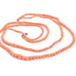 Two coral bead necklaces one larger, both comprised of hand-finished graduated coral beads, both
