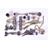 A collection of Indian brass and metal-ware items to include various cast deity plaques, eye