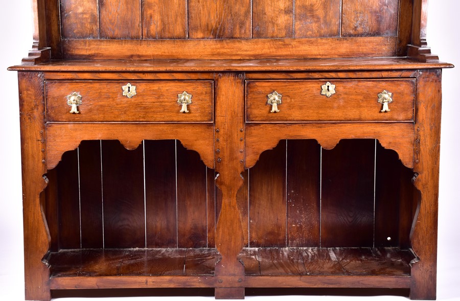 A large 18th century style oak dresser the top with three shelves, on a base with two drawers and - Image 7 of 9