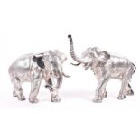 A pair of large realistically modelled filled silver elephants marked '925', maker 'CS', the largest