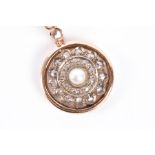 A yellow metal, diamond, and pearl pendant of circular form, suspended on a 14ct yellow gold