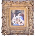 A 19th century miniature portrait on ivory depicting a lady at her writing table, 11.5 cm x 9.5