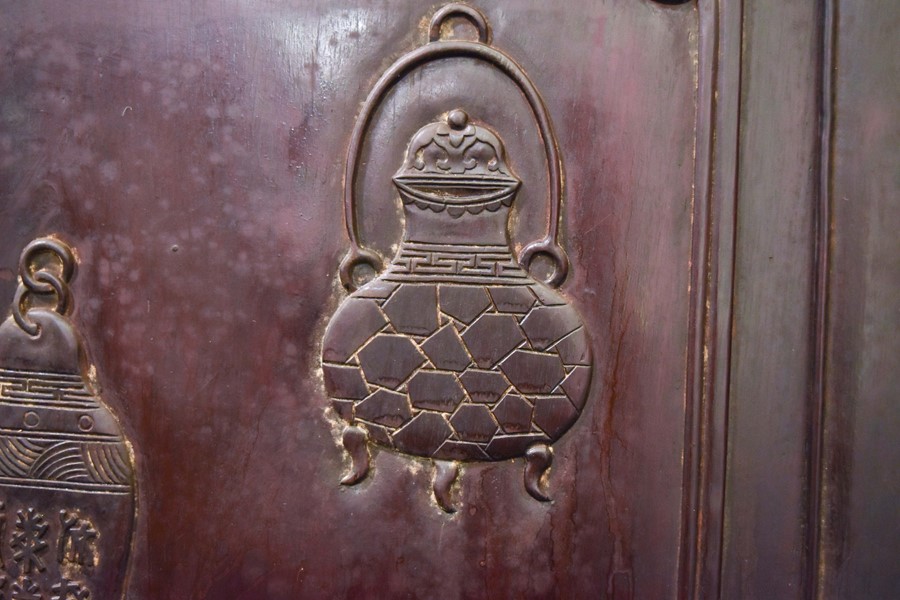 A pair of early 20th century Chinese hardwood cabinets with brass mounts, the panelled doors with - Image 4 of 18