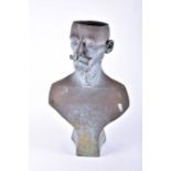An ornamental composite material garden planter modelled as a bust of a mustachioed man, patinated