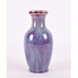 A Chinese flambé glazed baluster vase on pierced hardwood stand the vase with slender waisted neck