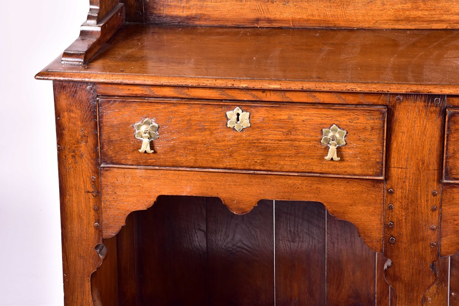 A large 18th century style oak dresser the top with three shelves, on a base with two drawers and - Image 3 of 9