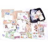 A large collection of national and international stamps and bank notes to include numerous albums,