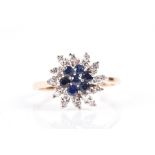 A 14ct yellow gold, diamond, and sapphire cluster ring centred with a floral cluster of sapphires