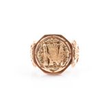 An unusual yellow gold ring possibly South American, the octagonal mount with reticulated figural