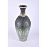 A floor standing Studio pottery bottle vase 20th century, the pear shaped body decorated with