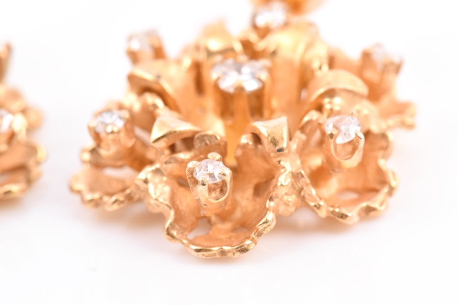 A pair of 14ct yellow gold and diamond floral cluster earrings each set with seven mixed-cut - Image 2 of 3