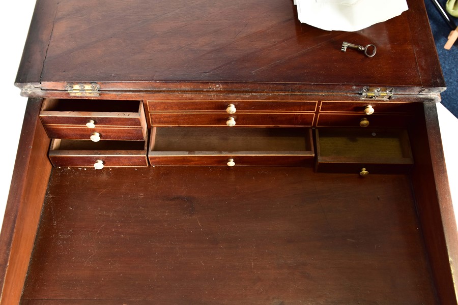 A George III 'Davenport' style writing desk of small proportions the sloping lid enclosing a bank of - Image 4 of 7