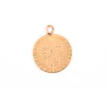 A George III spade guinea coin pendant with 9ct yellow gold mounted suspension loop.