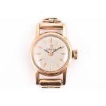 A 9ct yellow gold ladies Omega wristwatch with round baton dial, on 9ct yellow gold articulated